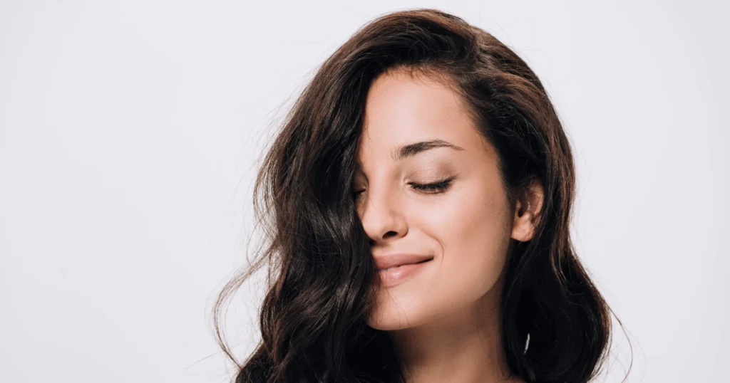 Smiling woman with healthy hair after TED Hair Restoration in Bend, OR