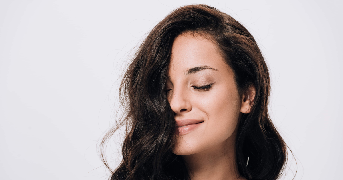 Smiling woman with healthy hair after TED Hair Restoration in Bend, OR