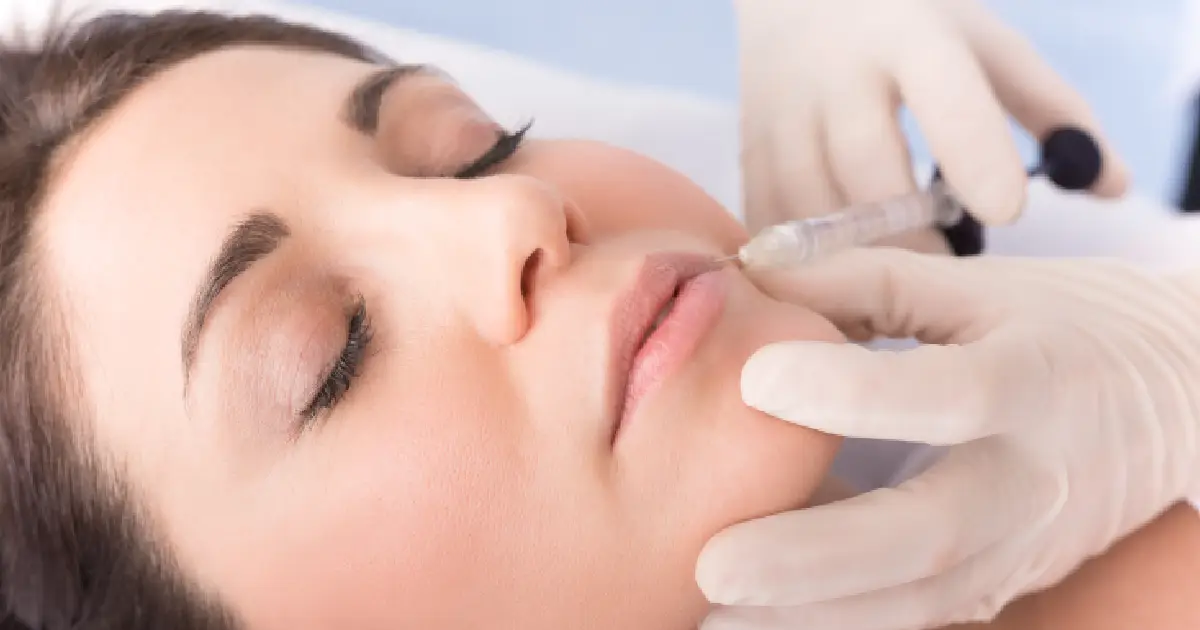 A woman getting a lip filler injection in Bend, OR